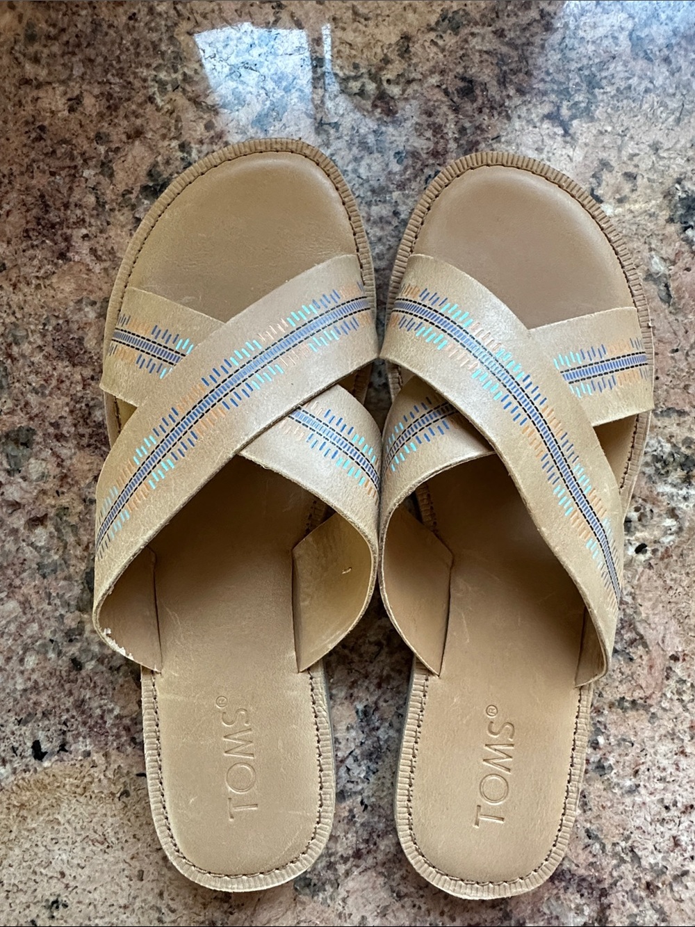 TOMS tan leather crossband slide sandals with colorful blue, aqua, aorange print